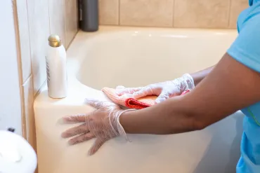 merry maid cleaning a bathtub